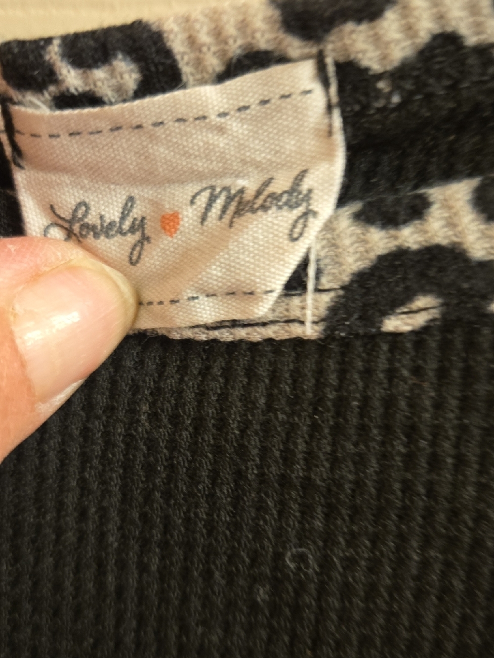 Lovely Melody Sleevles Black Top with Leopard Trim and Orange Heart